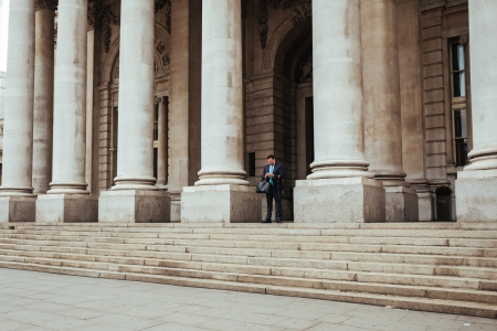 Man in front of a building with tall pillars Third Country Branches